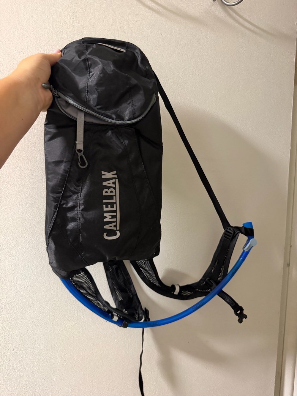 Camelbak Black Backpack with Blue Hydration Tube